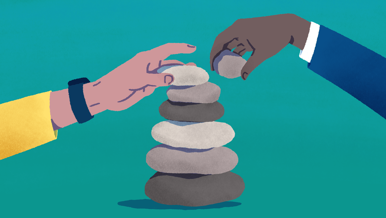 Two people stacking rocks
